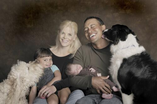 In this handout from the Tiger Woods family, (L-R) Sam, Elin, Tiger, Charlie Woods and their dogs Yogi (L) and Taz pose for a family photo on February 17, 2009 in Orlando, Florida. Charlie Woods was born on February 8, 2009.