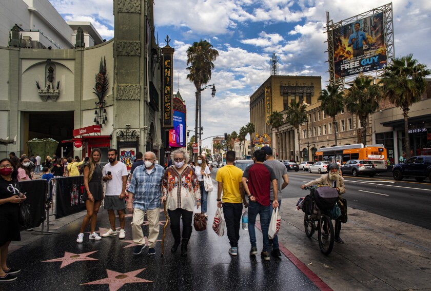 Pedestrians on the sidewalk on Hollywood Boulevard on Aug. 11.
