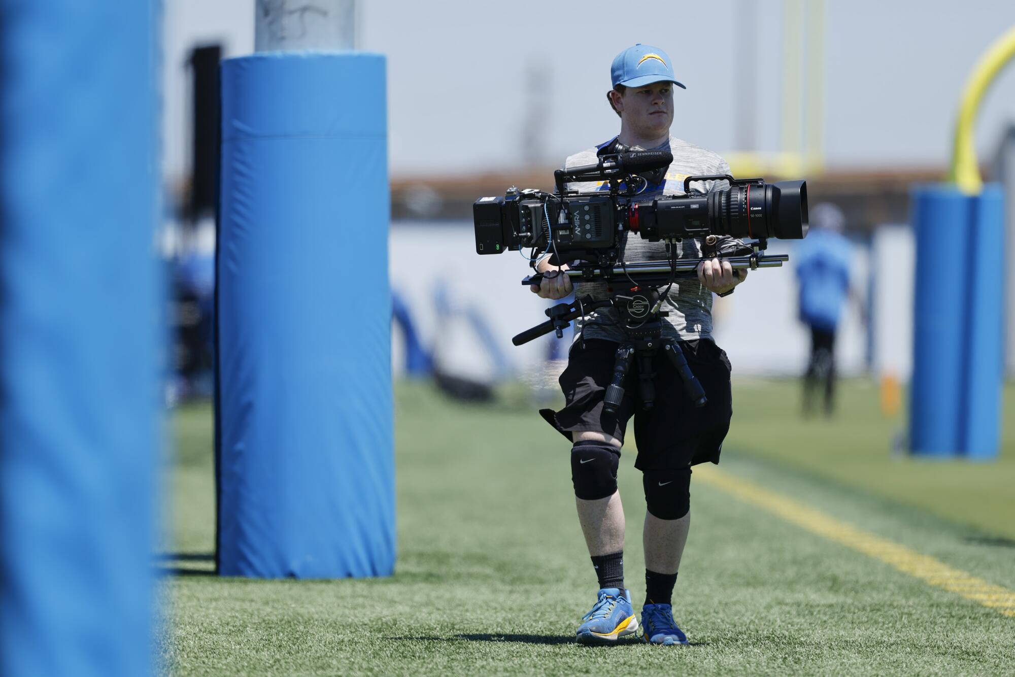 Meet the Chargers content material crew successful the schedule launch 'Tremendous Bowl' 1 A member of the Chargers' content team films players taking part in rookie minicamp.