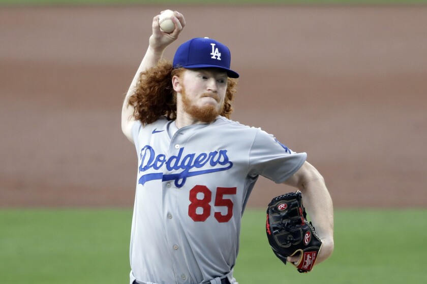 Los Angeles Dodgers starting pitcher Dustin May works against a San Diego Padres batter.