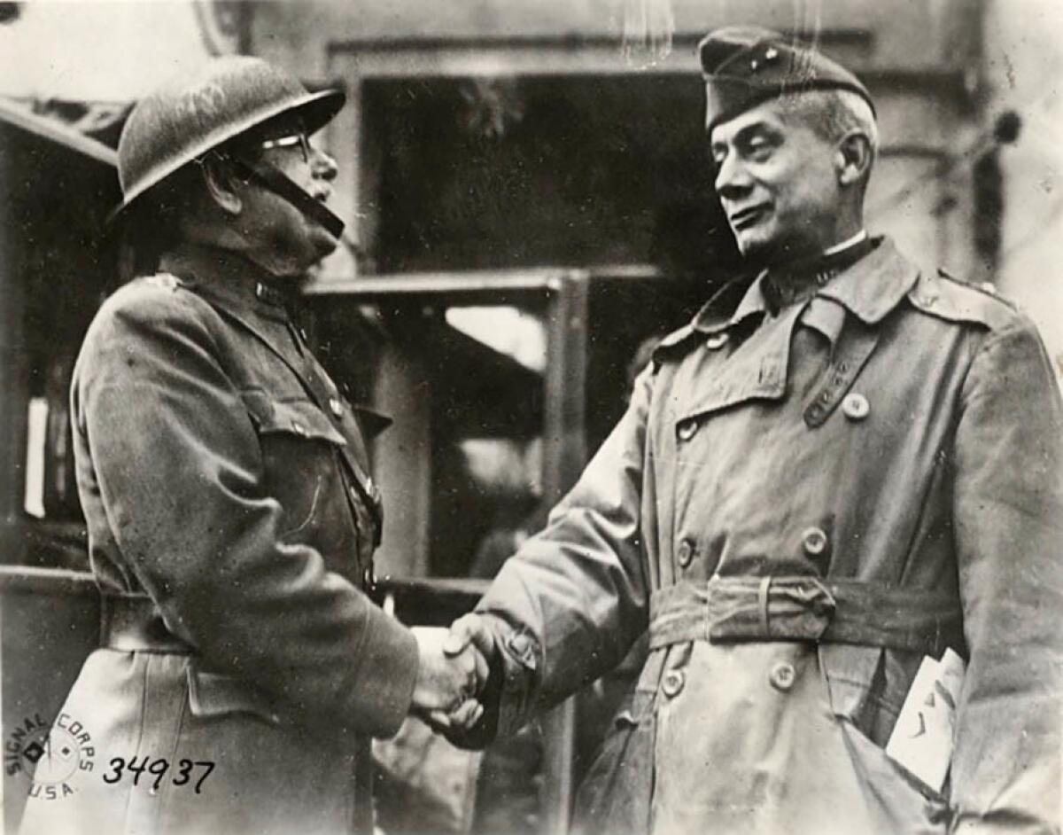 Nov. 11, 1918: In Tailly, France, Mjr. Gen. F. L. Winn, commander of the 89th Division, left, shakes the hand of Mjr. Gen. William M. Wright as Wright leaves to take command of the 1st Army Corps.