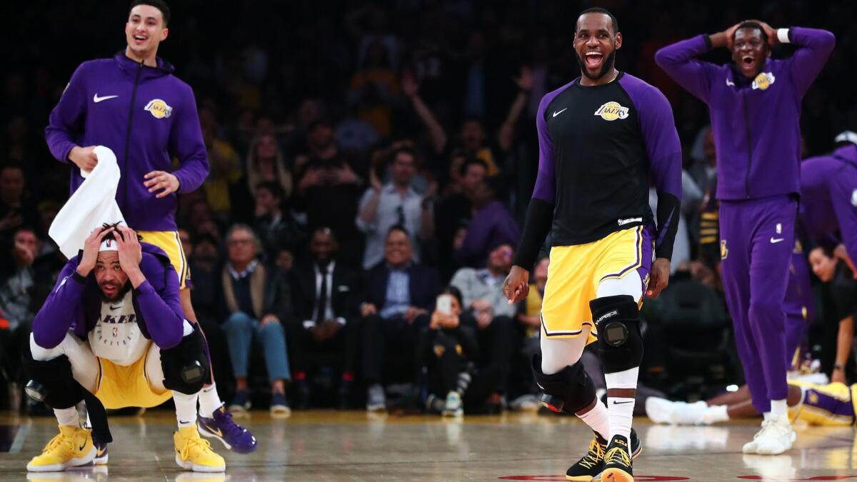 The Lakers bench react after a play by Lance Stephenson against the Washington Wizards during the first half at Staples Center on Tuesday.