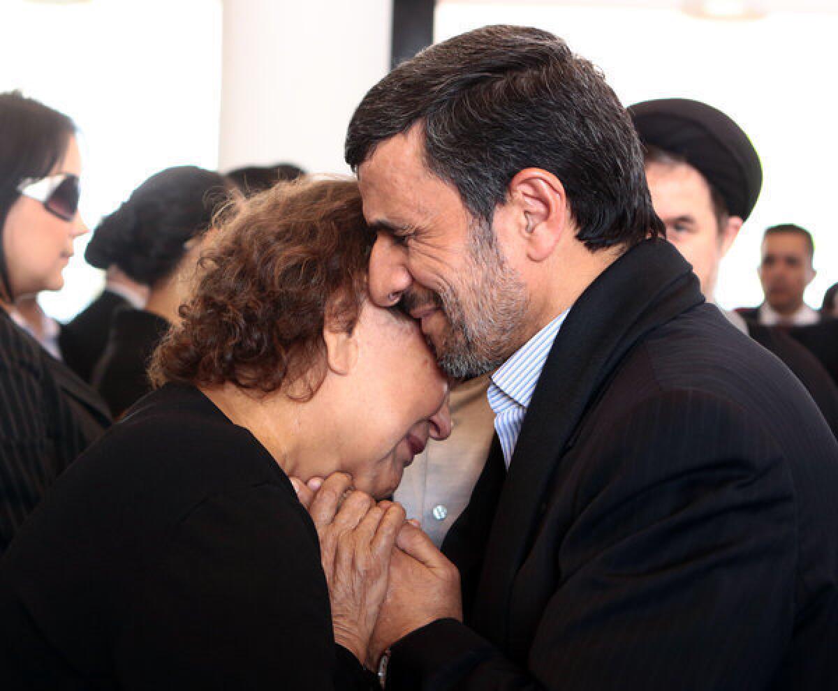Iranian President Mahmoud Ahmadinejad offers condolences to the mother of late President Hugo Chavez, Elena Frias de Chavez, during the Venezuelan leader's funeral Friday in Caracas, in a photo released by the press office of the Venezuelan presidency. The picture raised eyebrows in Iran because Islamic law dictates that a man should not touch a woman who is not a close relative.