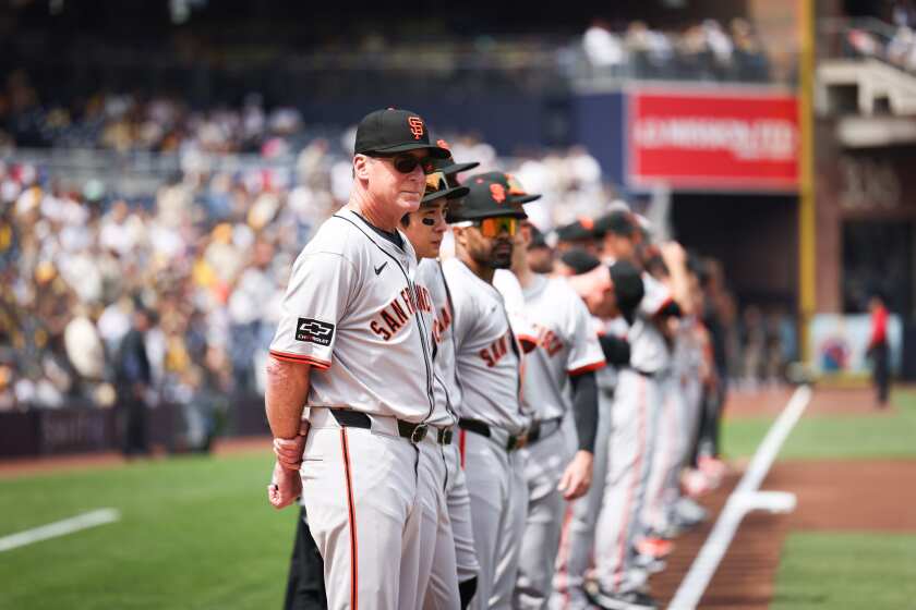 San Francisco Giants manger Bob Melvin stands for the anthem before Opening Day at Petco Park.