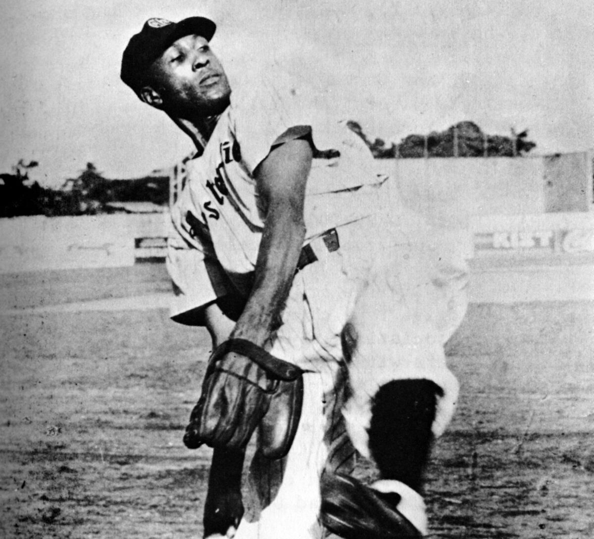 Chet Brewer, pitcher for the Estrellas Orientales of the Dominican Republic winter league, loosens up before a game in 1937.