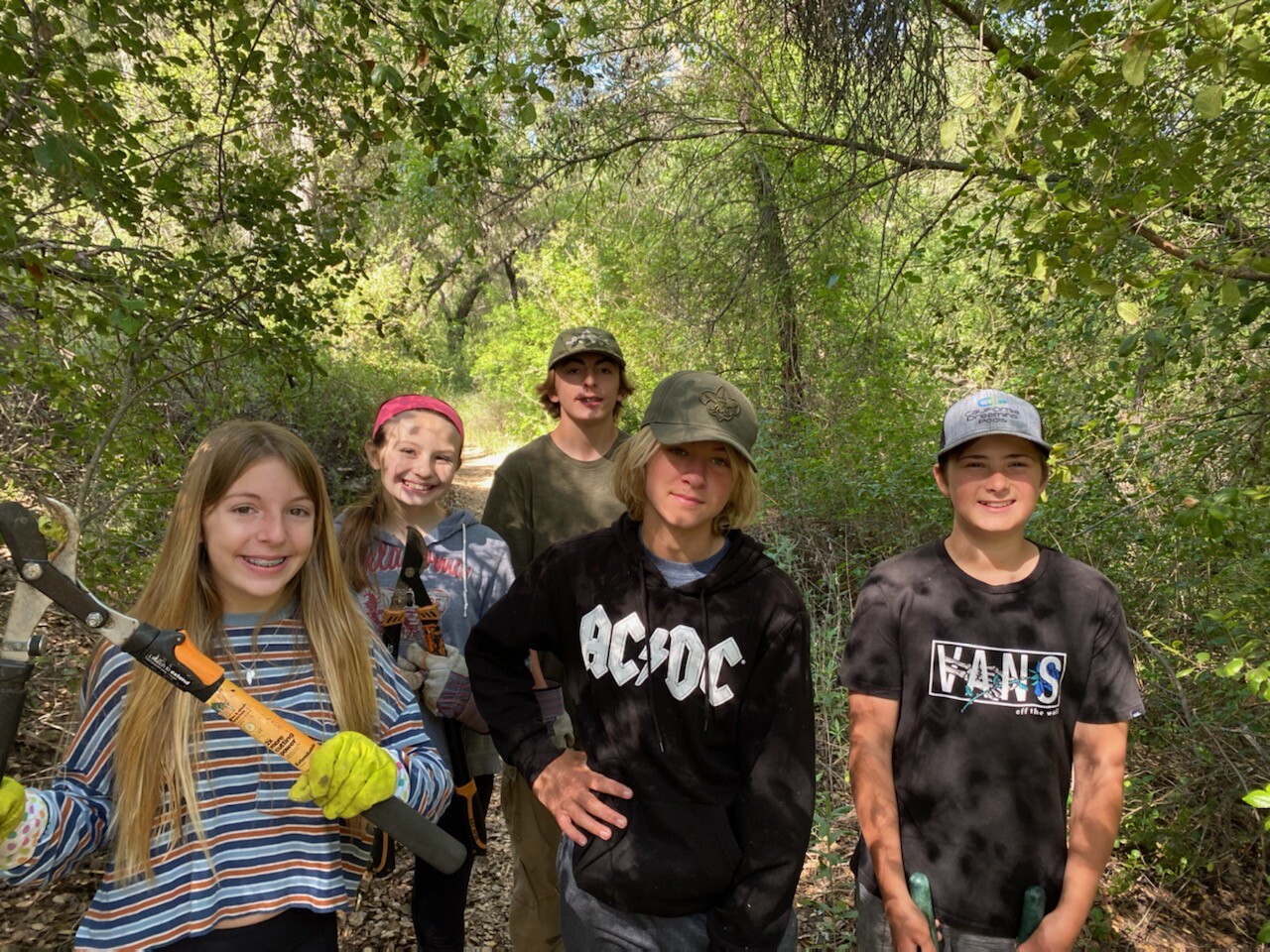 From left, Scarlet Carlsen, Natalie Derryberry, Cash Carlsen, Logan Eisel and Kenny Post worked on Creekside Trail.