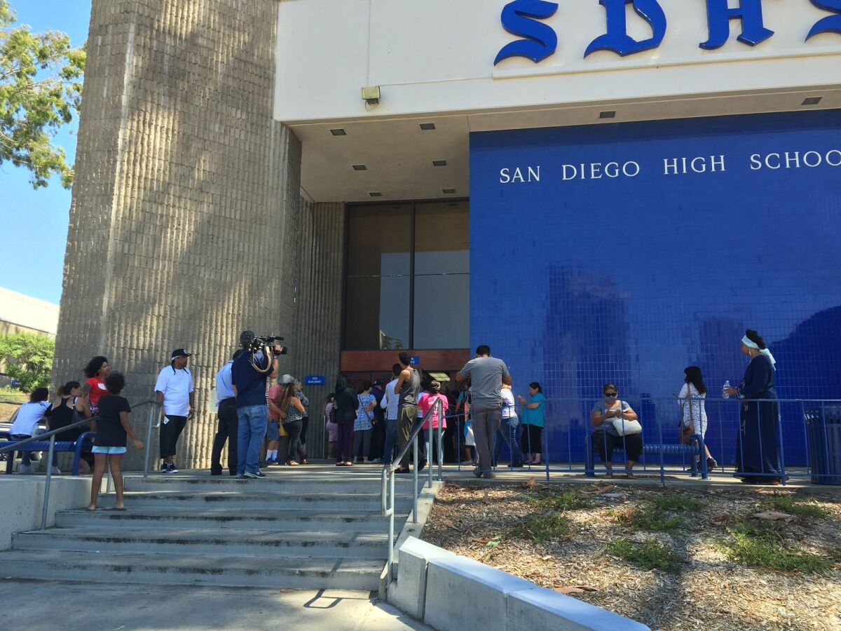Students at San Diego High School mill around after a lockdown that had kept them inside secured classrooms for about three hours Thursday. Lyndsay Winkley