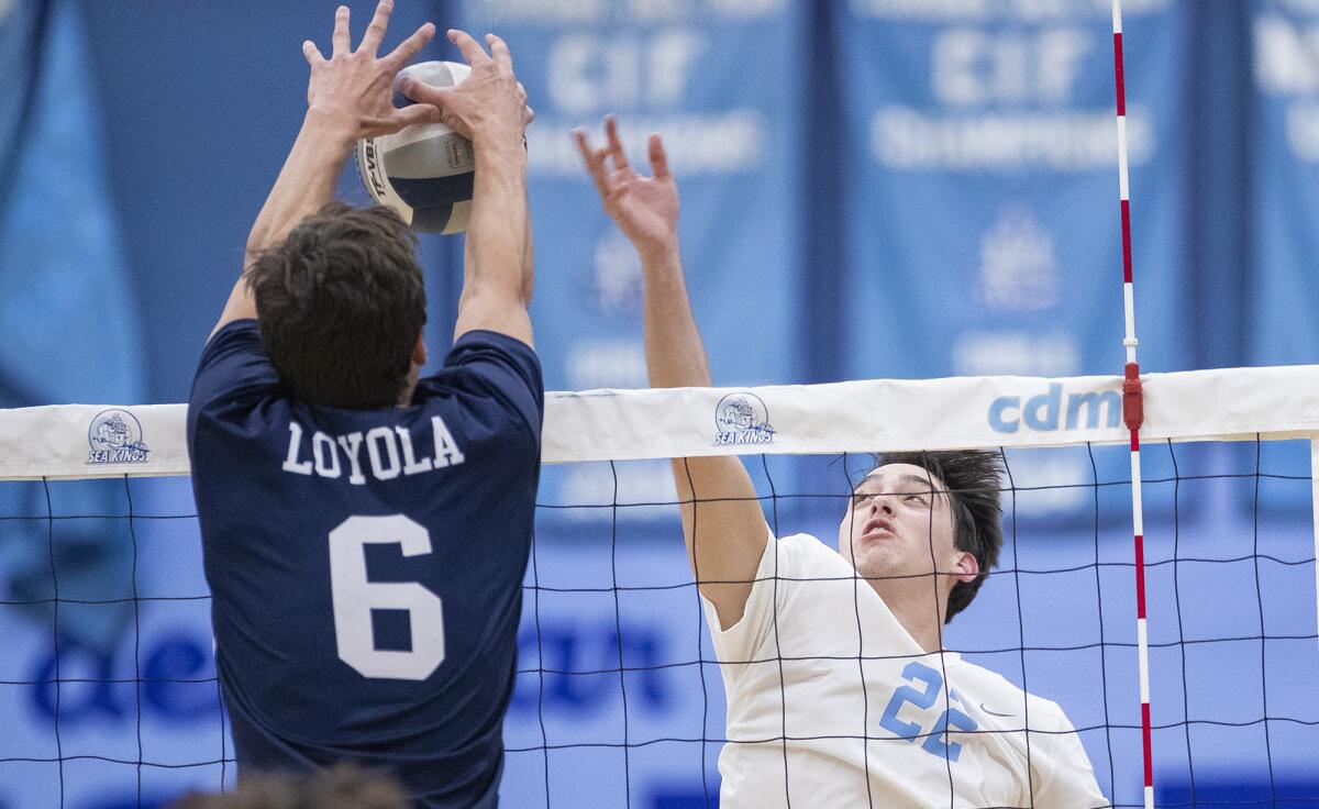 Corona del Mar's Justin Browning goes up against Loyola's Luke Turner during a nonleague match on Wednesday.