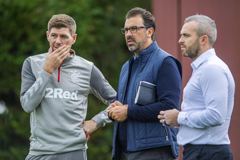 Galaxy technical director Jovan Kirovski joins Rangers manager Steven Gerrard to watch a training session