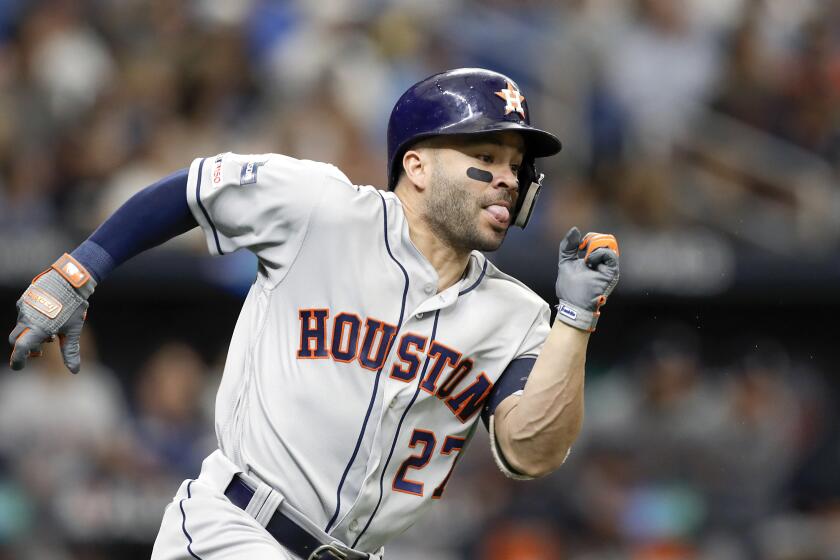 Houston Astros' Jose Altuve runs after hitting double against the Tampa Bay Rays during Game 3 of a baseball American League Division Series, Monday, Oct. 7, 2019, in St. Petersburg, Fla. (AP Photo/Chris O'Meara)