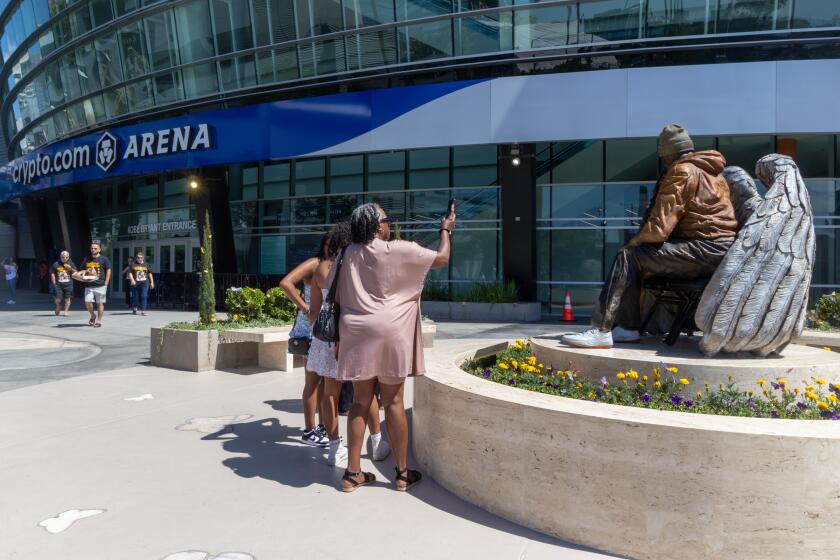 Los Angeles, CA - August 05: Newly unveiled statue of late Los Angeles Lakers star Kobe Bryant and his daughter, Gigi Bryant, outside Crypto.com Arena Los Angeles, CA on Monday, Aug. 5, 2024. (Zoe Cranfill / Los Angeles Times)