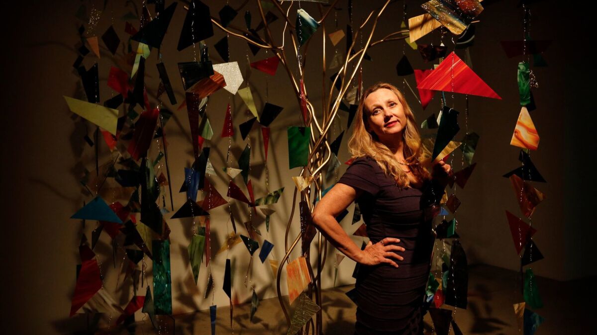 Artist Marnie Weber stands in her installation "Chapel of the Moon" at Gavlak gallery in Hollywood.