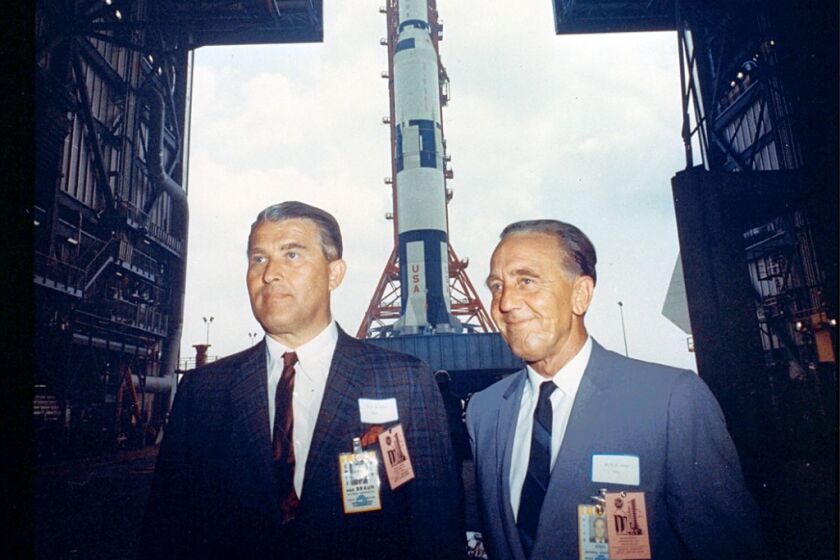 Marshall Space Flight Center director Wernher von Braun (left) joins Kennedy Space Center director chief Kurt Debus, both former German rocket engineers, for a Saturn 500F roll out from the Vehicle Assembly Building in Florida. Image credit: NASA