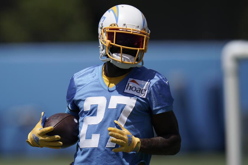 Los Angeles Chargers cornerback J.C. Jackson carries the ball at the NFL football team's practice facility.