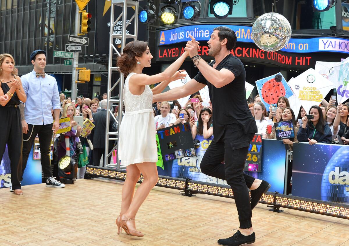 "Dancing With The Stars" Season 18 winners Meryl Davis and Maksim Chmerkovskiy perform at ABC's "Good Morning America" at Times Square.