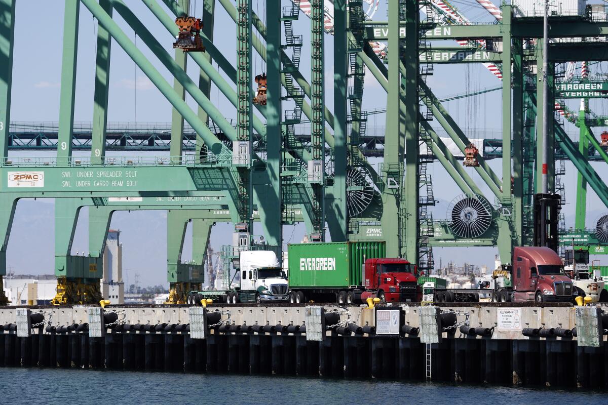 Cranes are idle Monday at the Port of Long Beach.
