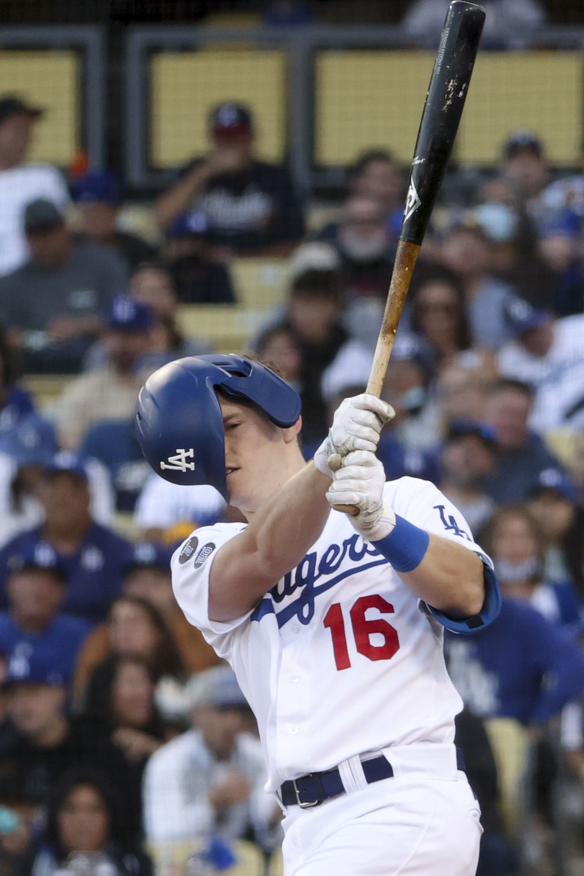Dodgers catcher Will Smith loses his helmet on a swing.