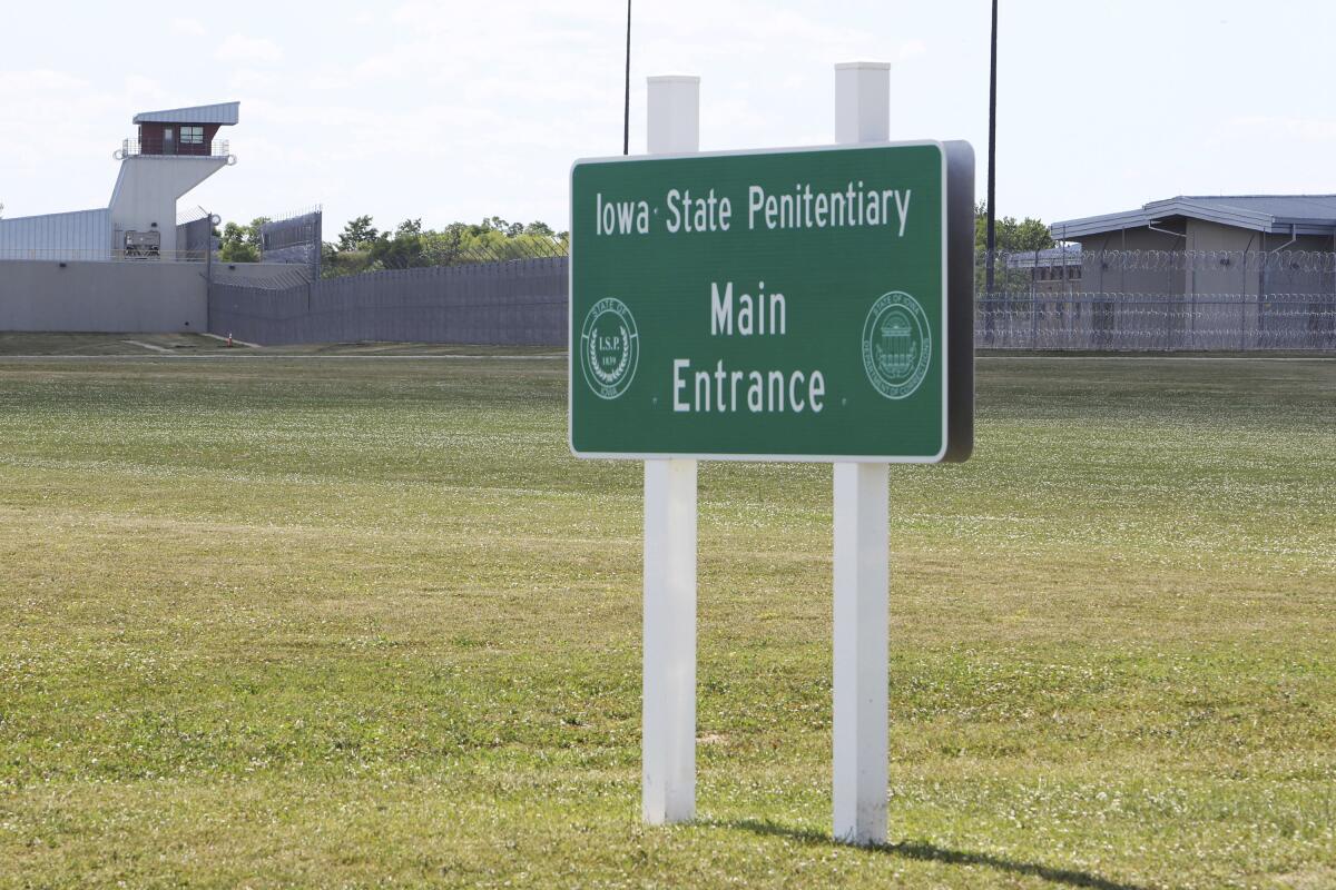 A sign stands outside the Iowa State Penitentiary in Fort Madison, Iowa. 