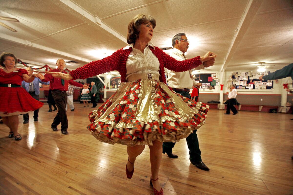 Terrie Livreri, 64, of Pinon Hills, dances with Mike Livreri, 62, at Cowtown Square Dance Center. Terrie says they have been coming here for 13 years.