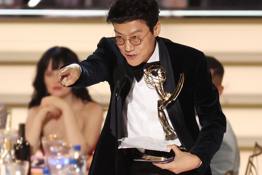 Hwang Dong-hyuk accepts the Emmy for Outstanding Directing for a Drama Series for “Squid Game ; Red Light, Green Light ” during the 74th Annual Primetime Emmy Awards held at the Microsoft Theater on September 12, 2022. (Myung J. Chun / Los Angeles Times)