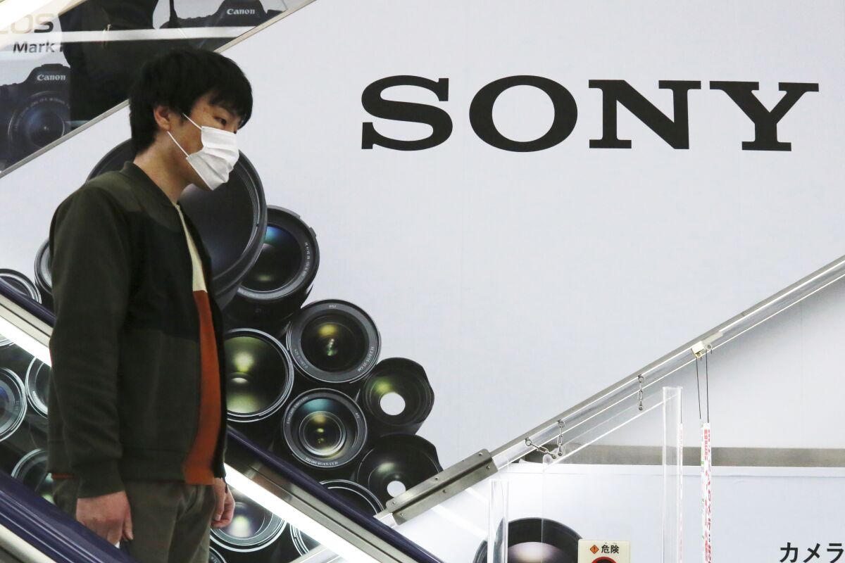 FILE - In this April 28, 2021, file photo, a man passes by the Sony logo at an electronics retail chain store in Tokyo. Sony’s April-June profit rose 9% to 211.8 billion yen ($1.9 billion) as the Japanese electronics and video game maker continued to benefit from a sales perk from the hit “Demon Slayer” animation film. (AP Photo/Koji Sasahara, File)