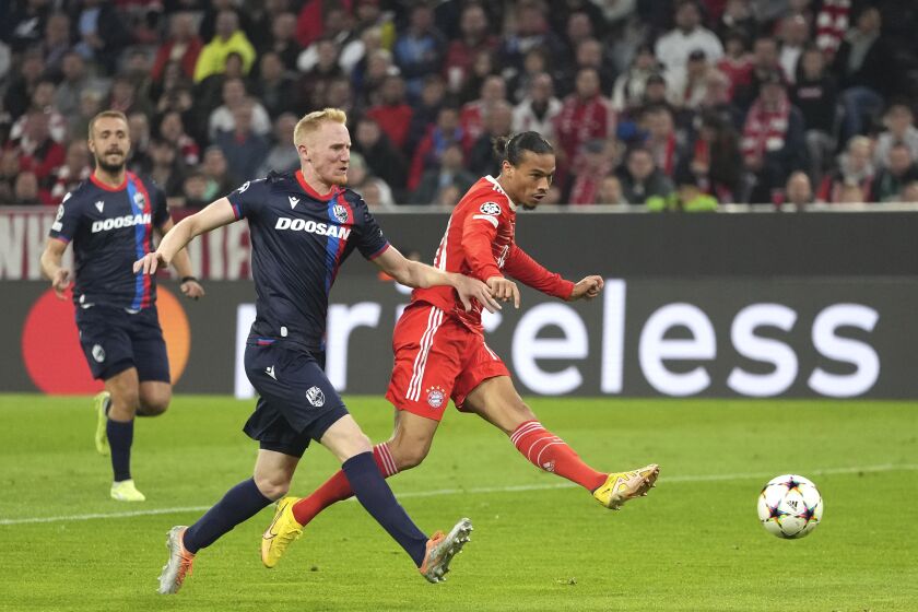 Bayern's Leroy Sane, right, scores the fourth goal against Plzen during the Champions League group C soccer match between Bayern Munich and Viktoria Plzen in Munich, Germany, Tuesday, Oct. 4, 2022. (AP Photo/Matthias Schrader)