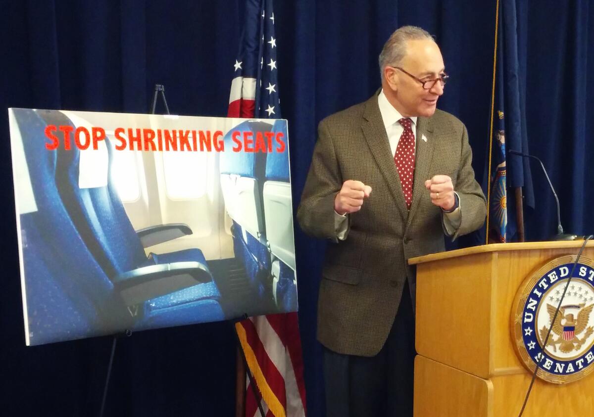 Sen. Charles E. Schumer (D-N.Y.) talks at a news conference about wanting to require the Federal Aviation Administration to establish seat-size standards for commercial airlines.