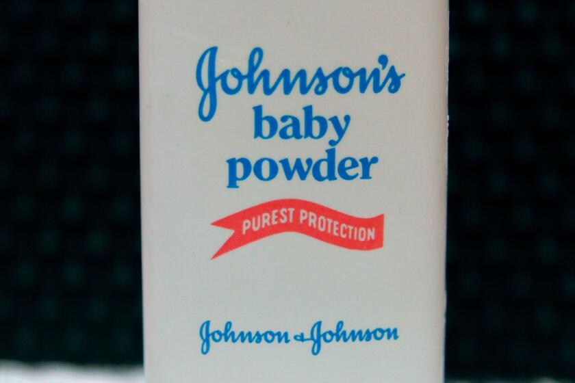 FILE - In this April 15, 2011, file photo, a bottle of Johnson's baby powder is displayed in San Francisco. A St. Louis jury has ordered Johnson & Johnson to pay a second huge award over claims that its talcum powder causes cancer. The company was ordered Monday, May 2, 2016, to pay a multi-million dollar settlement to a South Dakota woman who blamed her ovarian cancer on years of baby powder use. (AP Photo/Jeff Chiu File)