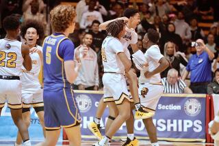 King/Drew players celebrate their Open Division victory over LACES on Saturday.