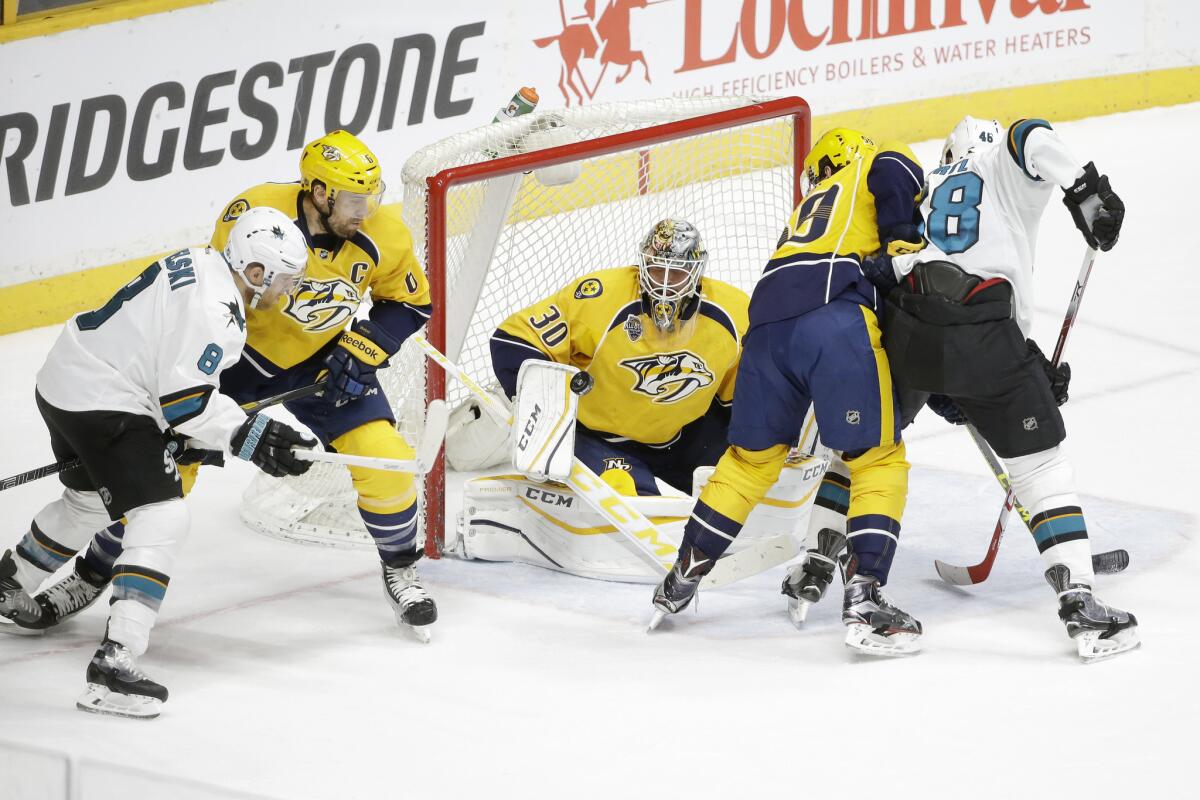 Predators goalie Carter Hutton (30) blocks a shot while playing the San Jose Sharks in the first period of a game on Apr. 2.