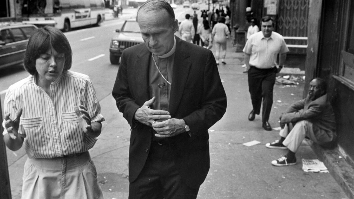 The Rt. Rev. Frederick Borsch, bishop of the Episcopal Diocese of Los Angeles, tours downtown's skid row with the Rev. Alice Callaghan in 1988.