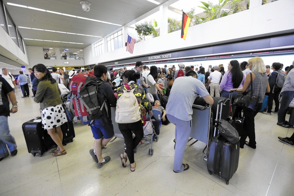 Passengers wait in long lines at LAX, which could see a significant rise in annual travelers by 2040.