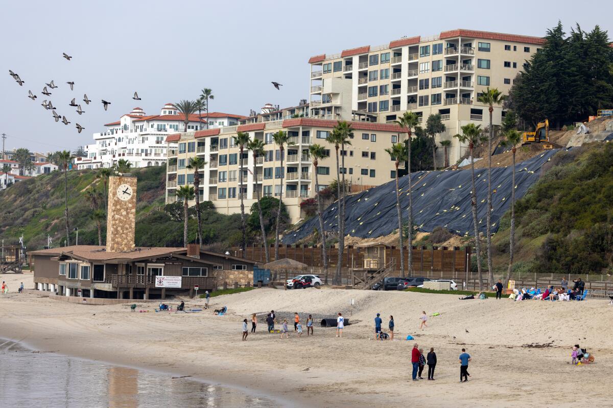 Tarps cover the collapsed bluff at Casa Romantica in San Clemente. The landslide in April shut down passenger rail service.