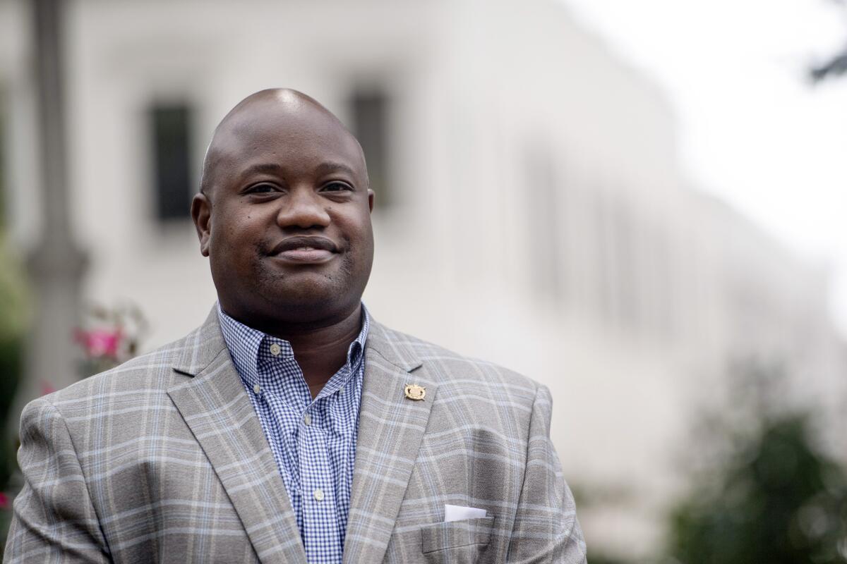 Black community leader Jeremy Ellis in a suit.