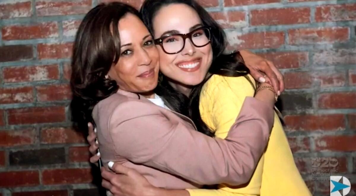 Vice President Kamala Harris, left, embraces her niece, Meena Harris.