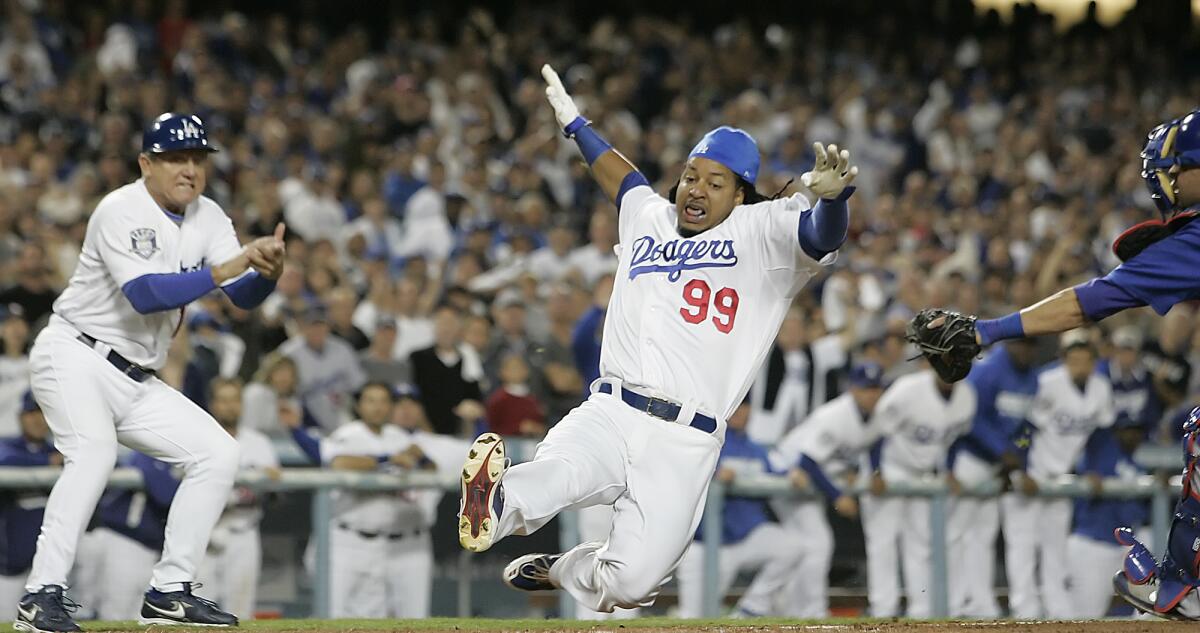Dodgers baserunner Manny Ramirez slides past the tag of Chicago Cubs catcher Geovany Soto.