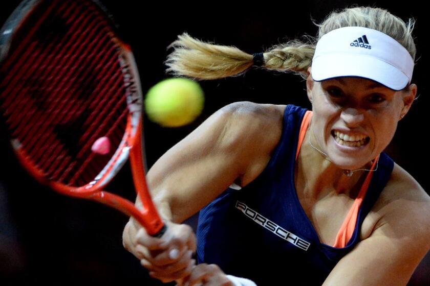 Angelique Kerber hits a return during her victory over Caroline Wozniacki at the Porsche Grand Prix final on Sunday.