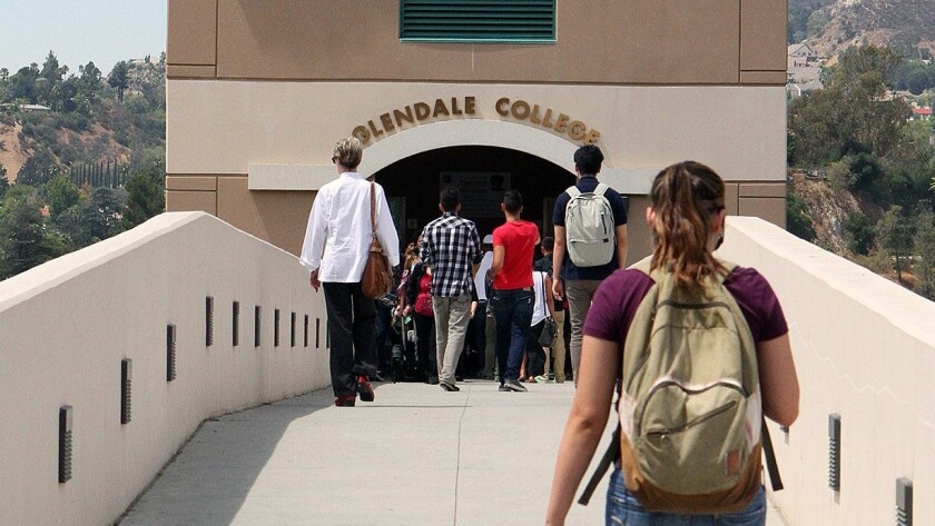 Students cross the parking bridge to the elevators to campus at Glendale Community College.