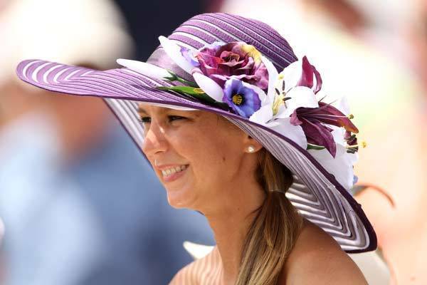 A horseracing fan wears a decorative hat prior to the 138th running of the Kentucky Derby at Churchill Downs on May 5, 2012 in Louisville, Kentucky.