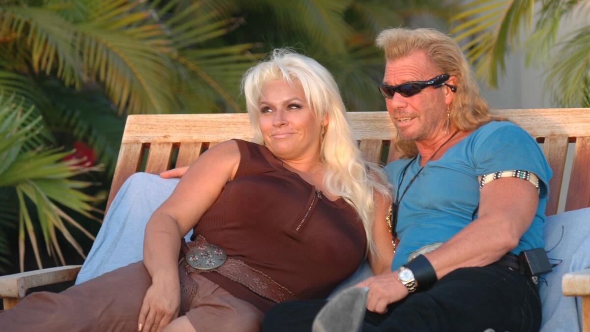Duane "Dog" Chapman and his wife, Beth, sit in their back yard in Honolulu in 2006.