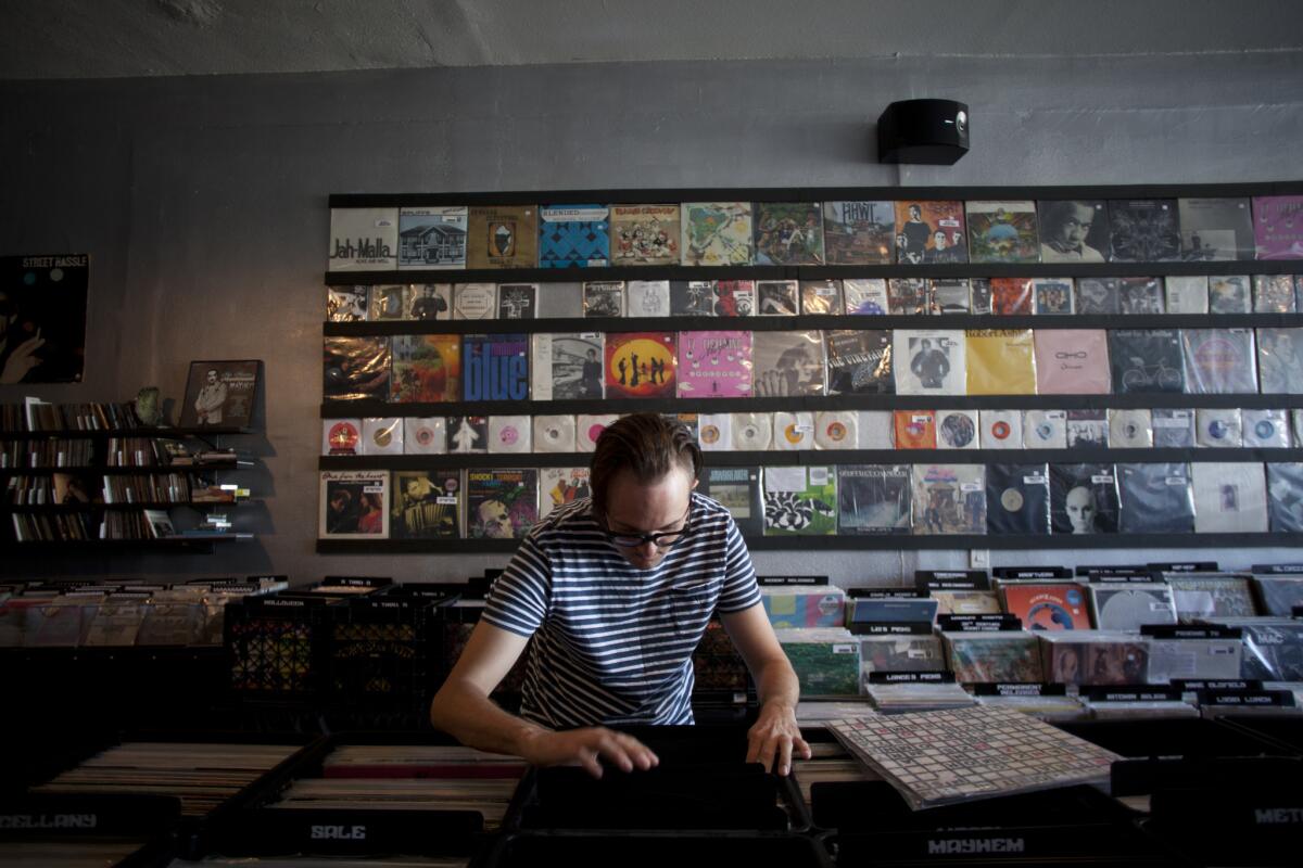 Matthew Walsh, of Highland Park, peruses the records at Permanent Records in Highland Park.