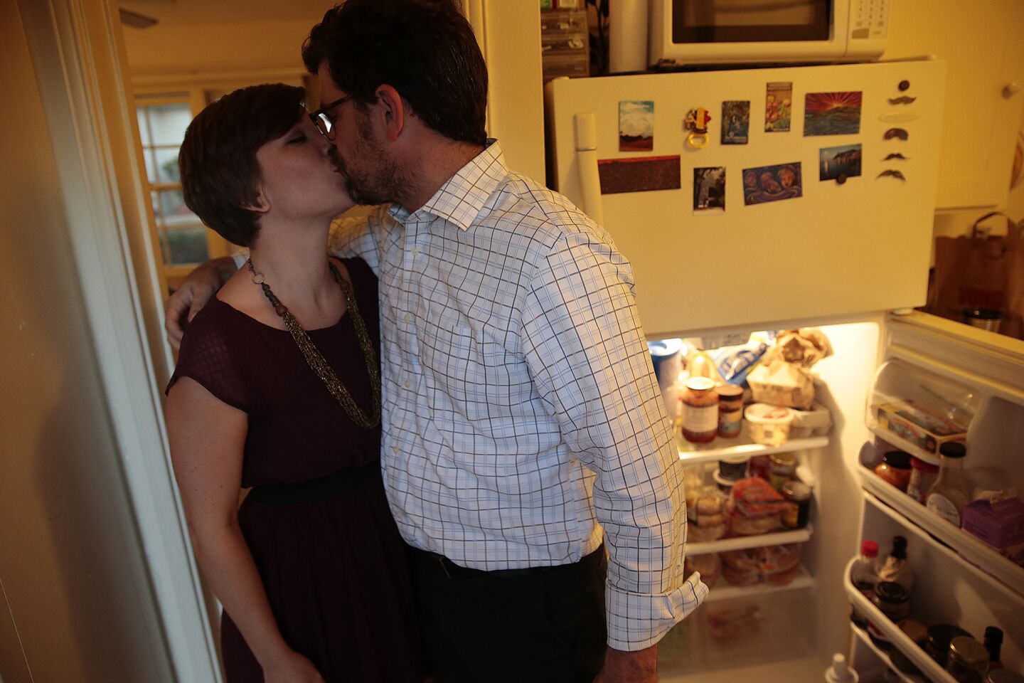 Ryan Bell, a former Seventh-day Adventist pastor who decided to live the last 12 months as if there is no God, is greeted by girlfriend Rebecca Pratt -- a devoted Christian -- at his Pasadena apartment. After Jan. 1, he'll announce where he stands on the existence of a supreme deity.