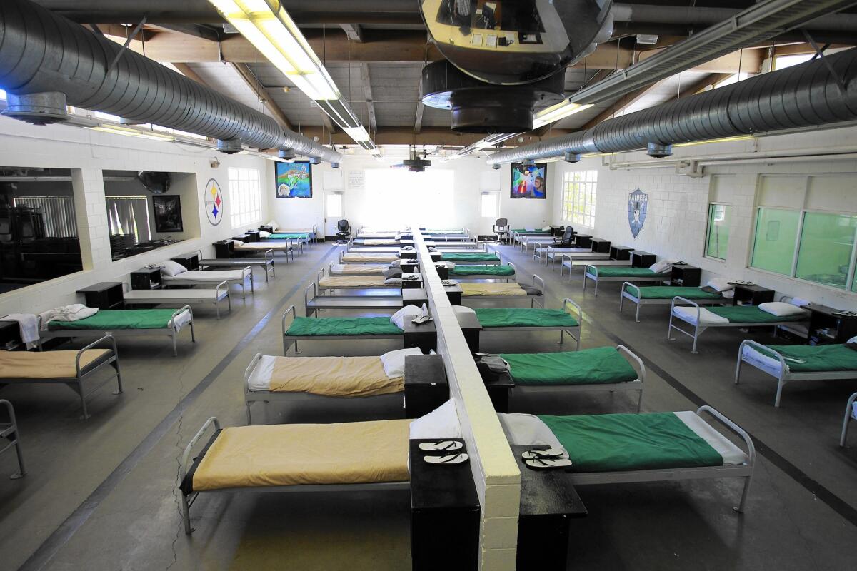 Beds line a dorm at now-closed Camp Miller, a Los Angeles County juvenile probation camp in Malibu. Campus Kilpatrick was built to be less punitive and more therapeutic.