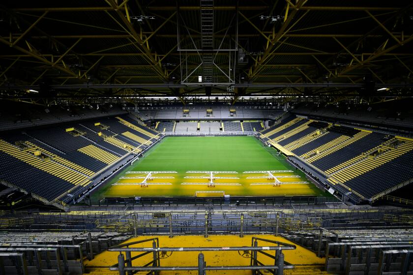 The empty stadium Signal Iduna Park of the Bundesliga club Borussia Dortmund is pictured in Dortmund, western Germany, on May 5, 2020, due to the spread of the novel coronavirus COVID-19. - German football is waiting for the green light as during Chancellor Angela Merkel's crucial meeting with the Presidents of the Lander (regional states) on May 6, 2020 will be decided whether or not to allow the Bundesliga to resume, behind closed doors and on the basis of a draconian health protocol. (Photo by Ina FASSBENDER / AFP) (Photo by INA FASSBENDER/AFP via Getty Images)