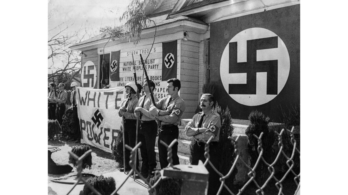 Jan. 30, 1972: Members of the National Socialist White People's Party stand outside their El Monte headquarters during an anti-Nazi protest by about 1,000 demonstrators.