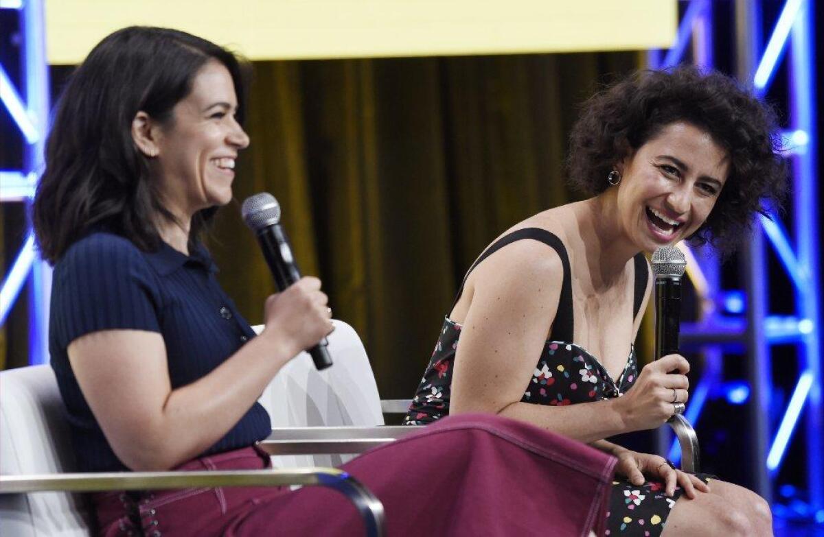 Abbi Jacobson, left, and Ilana Glazer of the series "Broad City" speak at the Television Critics Assn. press tour at the Beverly Hilton on Tuesday.