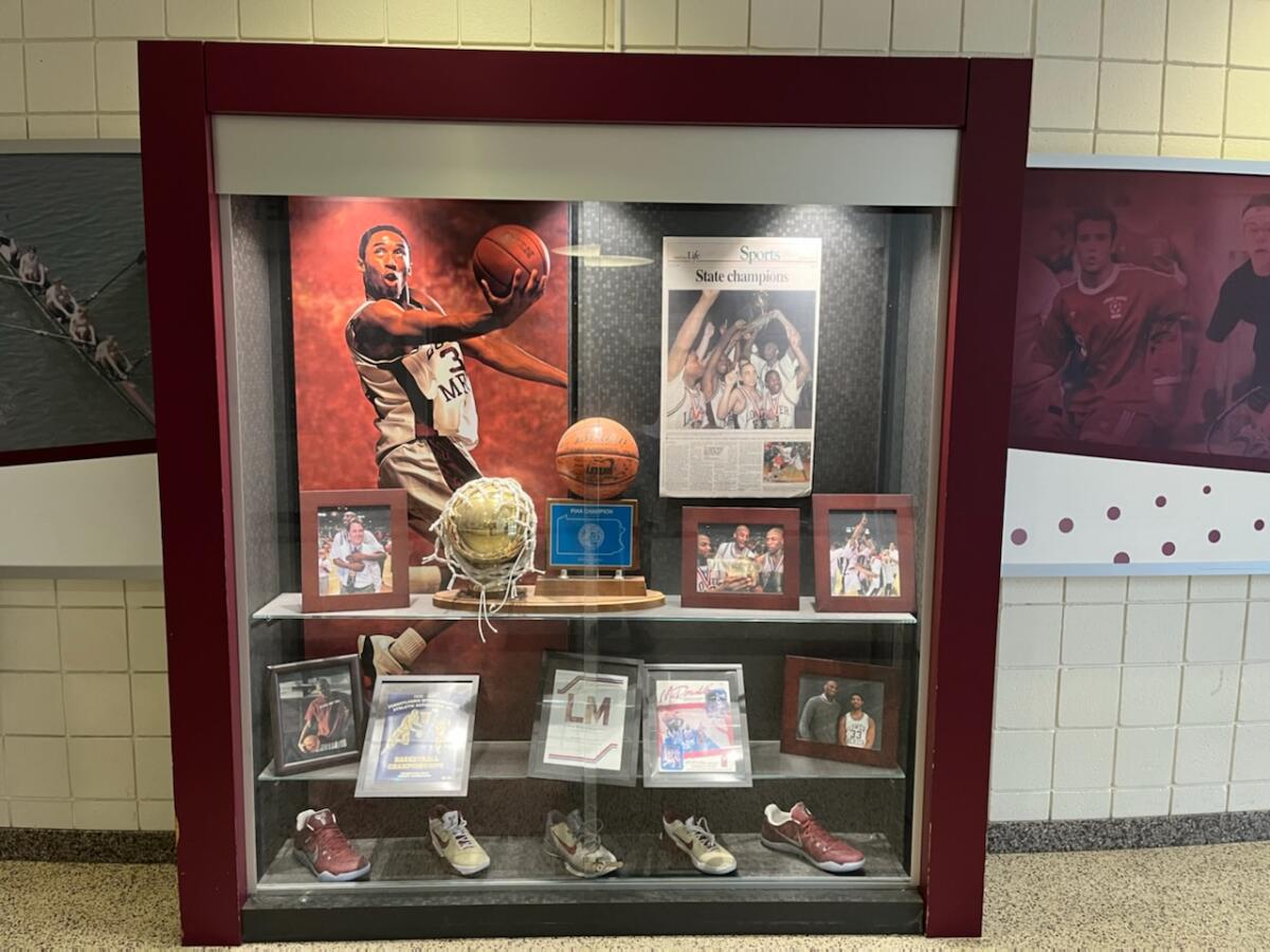 A display case featuring mementos from Kobe Bryant's senior year