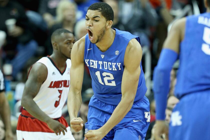 Freshman forward Kentucky Karl-Anthony Towns celebrates during the Wildcats' 58-50 win over Louisville on Saturday.