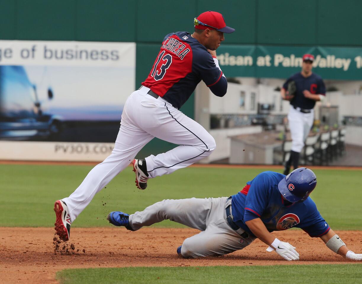 Darwin Barney is caught in a sixth inning double play by the Indians' Asdrubal Cabrera.