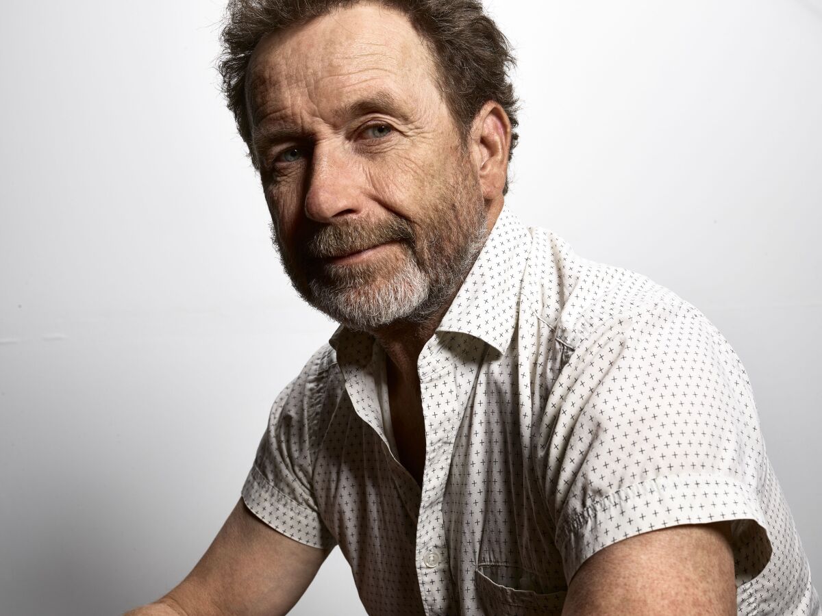 A headshot of a man